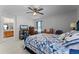 Comfortable main bedroom with ceiling fan and en suite bathroom at 3917 Pemberly Pines Cir, St Cloud, FL 34769