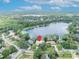 Beautiful lakefront property marked with a location pin nestled among trees, offering privacy and scenic views at 3960 Lake Mira Dr Dr, Orlando, FL 32817