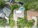 Overhead view of a home with pool near the lake, revealing backyard design and layout of the property at 3960 Lake Mira Dr Dr, Orlando, FL 32817