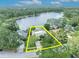 Overhead view of property outlining the house and its position near a beautiful lake at 3960 Lake Mira Dr Dr, Orlando, FL 32817