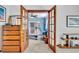 View from bedroom looking through wood French doors to sunroom with tiled floor at 3960 Lake Mira Dr Dr, Orlando, FL 32817
