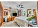 Relaxing bedroom with warm lighting, dresser with television, a window and comfortable carpet at 3960 Lake Mira Dr Dr, Orlando, FL 32817