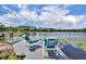 Inviting lake view from a private dock with chairs, perfect for relaxing and enjoying the scenery at 3960 Lake Mira Dr Dr, Orlando, FL 32817