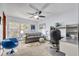 Bright home office with a comfortable sofa, desk, and plenty of natural light for productivity at 3960 Lake Mira Dr Dr, Orlando, FL 32817