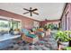 Spacious sunroom with ample seating, natural light, and a tranquil atmosphere, perfect for relaxation at 3960 Lake Mira Dr Dr, Orlando, FL 32817