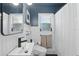 Elegant bathroom with wainscoting, modern fixtures, and natural light at 418 W Princeton St, Orlando, FL 32804
