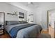Comfortable bedroom featuring hardwood floors, neutral colors, ceiling fan, and bright windows at 418 W Princeton St, Orlando, FL 32804