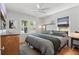 Cozy bedroom with natural light, hardwood floors, ceiling fan, and neutral decor at 418 W Princeton St, Orlando, FL 32804