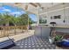 Outdoor deck perfect for entertaining, featuring string lights and a grilling area at 418 W Princeton St, Orlando, FL 32804