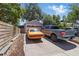 Brick driveway leading to a garage with an orange car and blue truck parked in front at 418 W Princeton St, Orlando, FL 32804