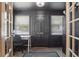 Inviting entryway with dark walls, tiled floors, and a cozy desk nook at 418 W Princeton St, Orlando, FL 32804