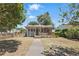 Charming home with inviting front porch, landscaped yard, and a brick pathway at 418 W Princeton St, Orlando, FL 32804