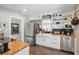 Stylish kitchen with stainless steel refrigerator, farmhouse sink, and open shelving at 418 W Princeton St, Orlando, FL 32804