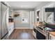Bright kitchen featuring stainless steel appliances, wood countertops, and white cabinetry at 418 W Princeton St, Orlando, FL 32804
