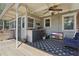 Covered patio featuring a built-in grill, ceiling fan, and comfortable seating area with a TV at 418 W Princeton St, Orlando, FL 32804