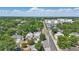 Aerial view of a neighborhood street with well-maintained homes and tree-lined sidewalks at 418 W Princeton St, Orlando, FL 32804