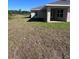 Backyard featuring a covered lanai and views of a preserved treeline at 4264 Sagefield Dr, St Cloud, FL 34773