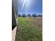 Backyard with newly installed sod and view of other homes in the community at 4264 Sagefield Dr, St Cloud, FL 34773