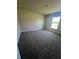 Comfortable bedroom featuring neutral carpeting and a window providing bright natural light at 4264 Sagefield Dr, St Cloud, FL 34773