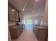 Modern kitchen features granite countertops, stainless steel appliances, and tile flooring at 4264 Sagefield Dr, St Cloud, FL 34773