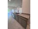 Kitchen island with granite countertops, stainless steel dishwasher, and undermount sink at 4264 Sagefield Dr, St Cloud, FL 34773
