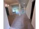 Spacious open-concept living area with neutral carpet, recessed lighting, and a view of the kitchen at 4264 Sagefield Dr, St Cloud, FL 34773