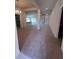Spacious open-concept living area with neutral carpet, recessed lighting, and a view of the kitchen at 4264 Sagefield Dr, St Cloud, FL 34773