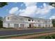 New townhome showcases a blend of stone and siding, enhanced by private garages and inviting entryways at 4283 Campsite Loop, Orlando, FL 32824