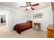 Cozy bedroom features a ceiling fan, plush carpet, and a window with natural light at 429 Kimberly Ct, Sanford, FL 32771