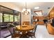 Cozy dining area with a view of the kitchen and the screened patio at 429 Kimberly Ct, Sanford, FL 32771