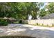 Expansive driveway with privacy fence, mature trees, and beautiful landscaping at 429 Kimberly Ct, Sanford, FL 32771