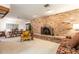 Open living space with brick fireplace and dining area at 429 Kimberly Ct, Sanford, FL 32771