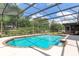 Beautiful screened-in pool with a brick trim and lush backyard view at 429 Kimberly Ct, Sanford, FL 32771