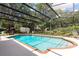 Sparkling screened-in pool with brick trim, surrounded by a patio and landscaping at 429 Kimberly Ct, Sanford, FL 32771