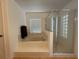 Bright bathroom featuring a bathtub with tile surround and separate glass-enclosed shower at 4920 E Lake Cove Blvd, St Cloud, FL 34771