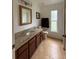 Bathroom vanity with granite counters and updated fixtures at 4920 E Lake Cove Blvd, St Cloud, FL 34771