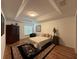 Relaxing bedroom with tray ceiling, wood floors, and large window with natural light at 4920 E Lake Cove Blvd, St Cloud, FL 34771