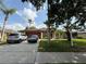 Charming single-Gathering home featuring a well-manicured lawn, mature trees, and a two-car garage at 4920 E Lake Cove Blvd, St Cloud, FL 34771