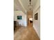 Bright foyer features neutral paint, tiled floors, and stylish chandelier at 4920 E Lake Cove Blvd, St Cloud, FL 34771