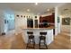 Kitchen with granite counters and stainless steel appliances, featuring bar seating at 4920 E Lake Cove Blvd, St Cloud, FL 34771