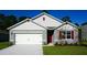 Charming single-Gathering home with a well-maintained lawn and a two-car garage, offering curb appeal at 5063 Tana Ter, St Cloud, FL 34772