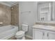 Cozy bathroom featuring ceramic tile, shower and bath combo, and vanity at 5118 Adelaide Dr, Kissimmee, FL 34746