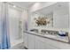 Bright bathroom with double granite vanity, shower, and fresh finishes at 5133 Masser Rd, St Cloud, FL 34772