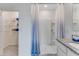 Shower and bathroom combo features shelving for storage and a modern vanity at 5133 Masser Rd, St Cloud, FL 34772