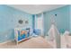 Themed Bedroom with a cute crib, fun wallpaper, and playful decorations create a magical space at 5133 Masser Rd, St Cloud, FL 34772