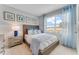 Cozy bedroom with natural light, complemented by serene blue accents and stylish decor at 5133 Masser Rd, St Cloud, FL 34772
