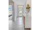 Inviting entryway showcasing stylish console table and decorative mirror, creating a warm ambiance at 5133 Masser Rd, St Cloud, FL 34772