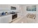 Kitchen features stainless appliances, granite counters, double sink, and white cabinets at 5133 Masser Rd, St Cloud, FL 34772