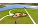 Aerial view of a community playground with lake, gazebo, and sidewalks winding through lush green space at 5133 Masser Rd, St Cloud, FL 34772