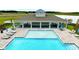 Community pool with outdoor seating, umbrellas, and a spacious deck at 5133 Masser Rd, St Cloud, FL 34772